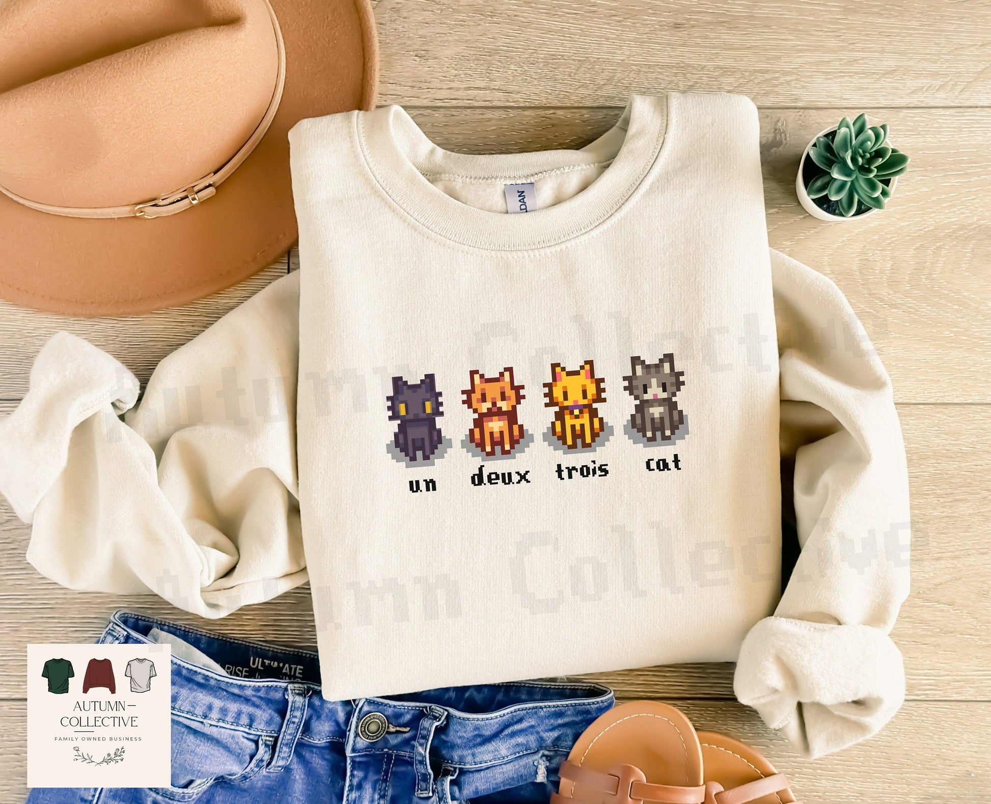 Un, Deux, Trois, Cat Sweatshirt in color sand, cat colors are in order, black, orange, yellow, and grey